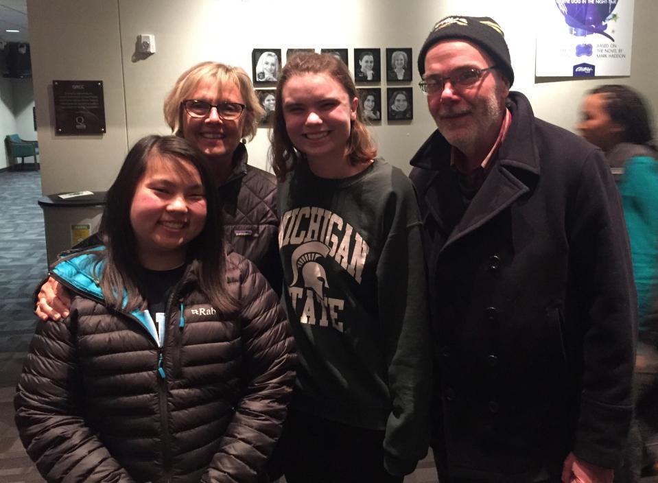 Zoe Higgins, left, and her dad Jim Higgins, right, pose with actor Kyla Kralapp, second from right, after a performance of "The Wolves" in Grand Rapids, Mich.