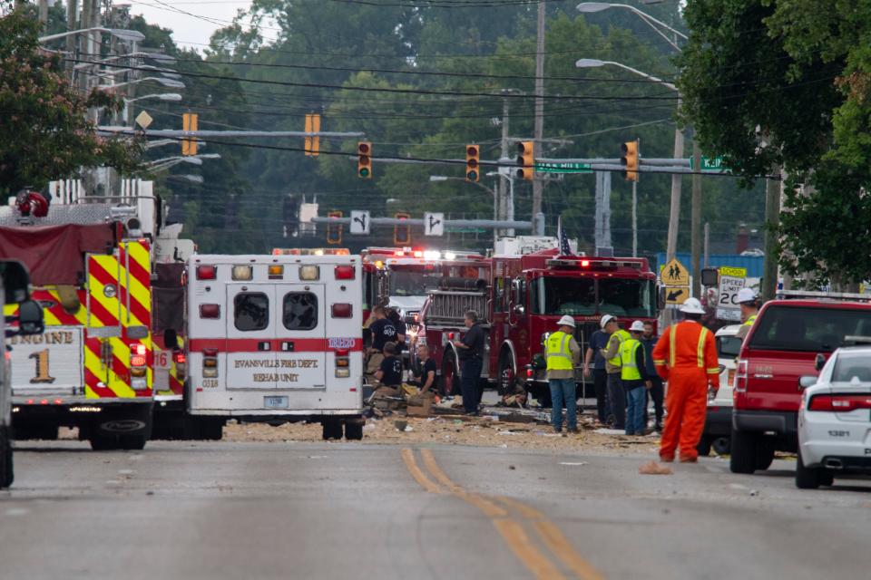 Emergency crews respond to a house explosion in the 1000 block of North Weinbach Avenue in Evansville, Ind., Wednesday, Aug. 10, 2022.