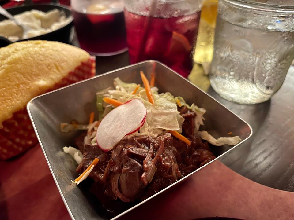 Hoop-De-Doo Revue at Disney -  meat inn a bowl topped with coleslaw