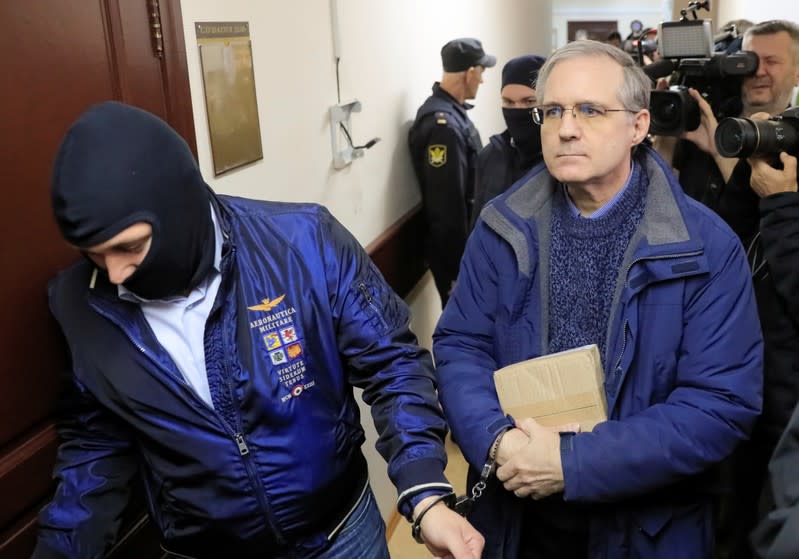 Former U.S. Marine Paul Whelan, who was detained and accused of espionage, is escorted inside a court building in Moscow