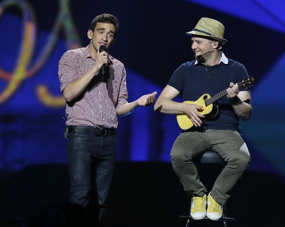 Gianluca of Malta performs his song "Tomorrow" with his band during a rehearsal for the final of the Eurovision Song Contest at the Malmo Arena in Malmo, Sweden, Friday, May 17, 2013. The contest is run by European television broadcasters with the event being held in Sweden as they won the competition in 2012, the final will be held in Malmo on May 18. (AP Photo/Alastair Grant)