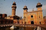 <b>LAHORE, PAKISTAN: </b>Pigeons fly over the Wazir Khan Mosque in the walled city of Old Lahore in Pakistan. The great mosque was built by built by Hakim Shaikh Ilm-ud-din Ansari, court physician to the Mughal emperor Shah Jahan who later rose to the status of governor. Construction began around 1634–1635 and lasted seven years.