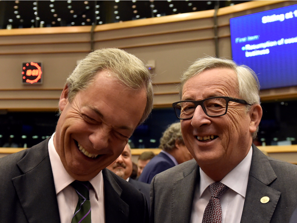 European Commission President Jean-Claude Juncker welcomes Nigel Farage, the leader of the United Kingdom Independence Party, prior to a plenary session at the European Parliament on the outcome of the