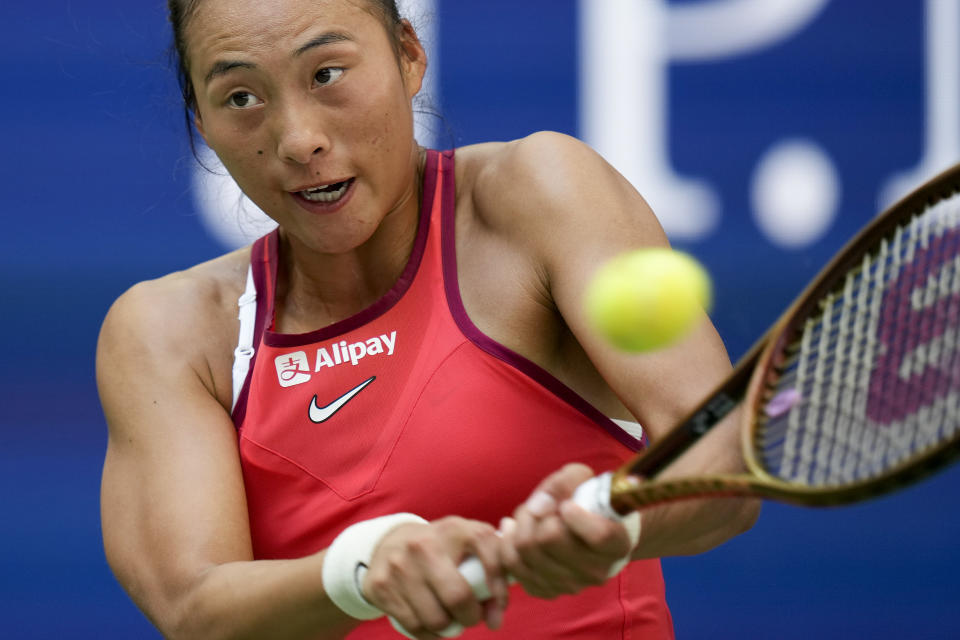 Zheng Qinwen, of China, returns a shot to Aryna Sabalenka, of Belarus, during the quarterfinals of the U.S. Open tennis championships, Wednesday, Sept. 6, 2023, in New York. (AP Photo/Seth Wenig)