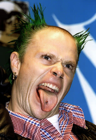 FILE PHOTO: The Prodigy lead singer Keith Flint sticks out his tongue at press photographers during the 1996 MTV Europe Music Awards gala in London, Britain November 14, 1996. REUTERS/Greg Bos/File Photo/File Photo