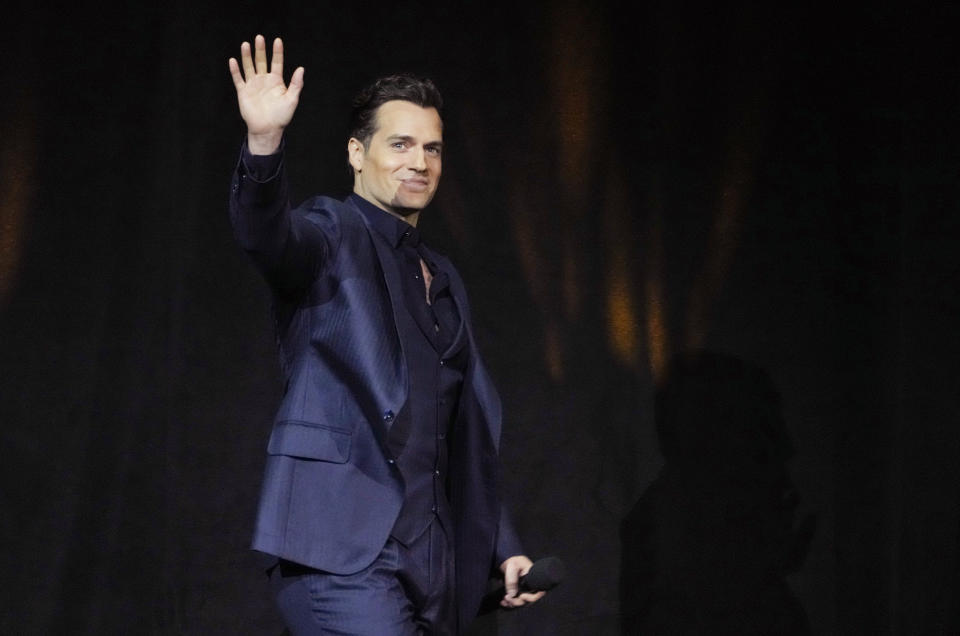 Henry Cavill, a cast member in the upcoming film "The Ministry of Ungentlemanly Warfare," waves to the audience during the Lionsgate presentation at CinemaCon 2024, Wednesday, April 10, 2024, at Caesars Palace in Las Vegas. (AP Photo/Chris Pizzello)