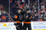 Philadelphia Flyers' Joel Farabee, right, and Owen Tippett celebrate after a goal by Farabee during the second period of an NHL hockey game against the Minnesota Wild, Thursday, March 23, 2023, in Philadelphia. (AP Photo/Matt Slocum)