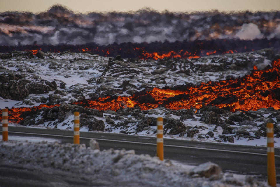 A view of lava near to the road to Grindavík, close to the exit for the Blue Lagoon, in Grindavík, Iceland, Thursday, Feb. 8, 2024. A volcano in southwestern Iceland has erupted for the third time since December and sent jets of lava into the sky. The eruption on Thursday morning triggered the evacuation the Blue Lagoon spa which is one of the island nation’s biggest tourist attractions. (AP Photo /Marco Di Marco)