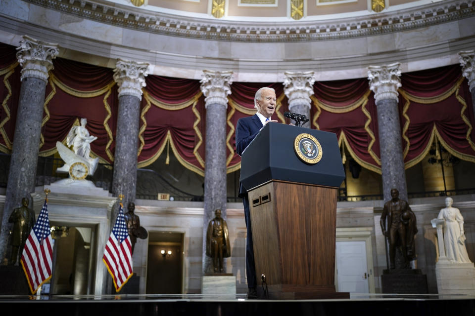 President Joe Biden speaks from Statuary Hall at the U.S. Capitol to mark the one year anniversary of the Jan. 6 riot at the Capitol by supporters loyal to then-President Donald Trump, Thursday, Jan. 6, 2022, in Washington. (Drew Angerer/Pool via AP)