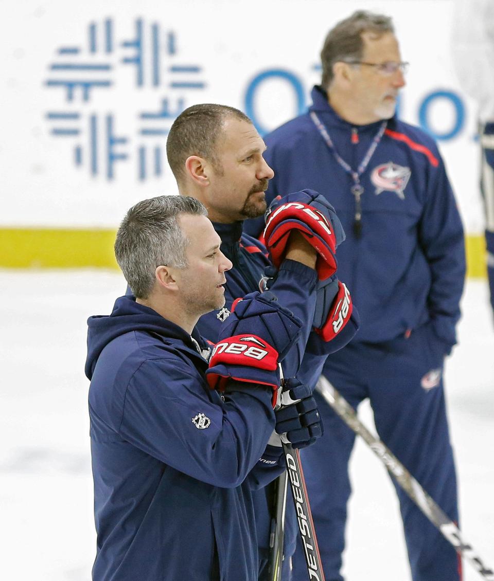 Columbus Blue Jackets special teams consultant Martin St. Louis, assistant coach Brad Larsen and head coach John Tortorella watch practice on January 28, 2019.  [Kyle Robertson/Dispatch]