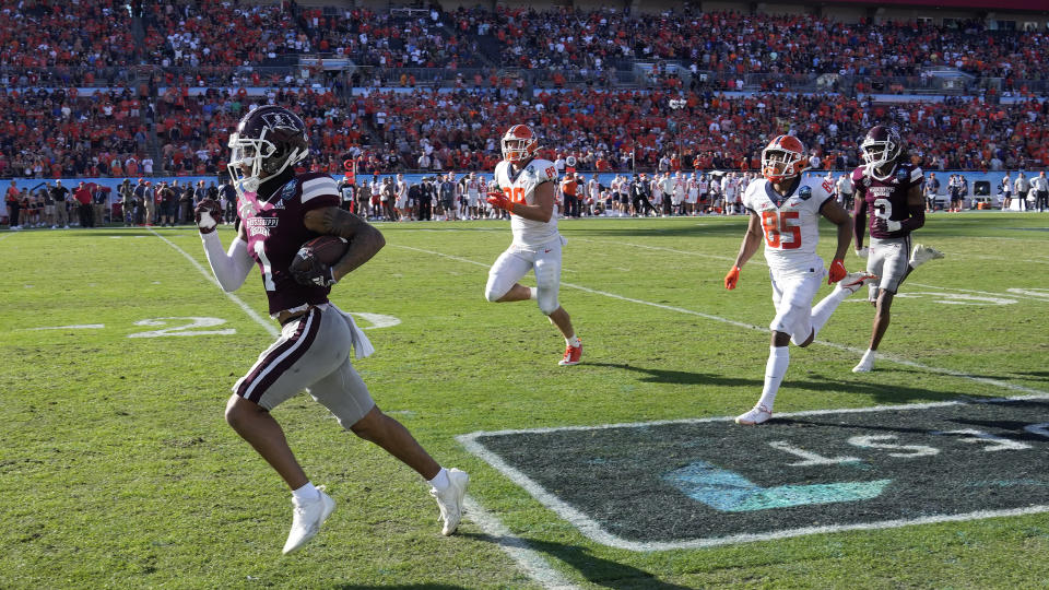 Mississippi State cornerback Marcus Banks (1) runs a fumble back 60-yards for a score against Illinois during the second half of the ReliaQuest Bowl NCAA college football game Monday, Jan. 2, 2023, in Tampa, Fla. (AP Photo/Chris O'Meara)