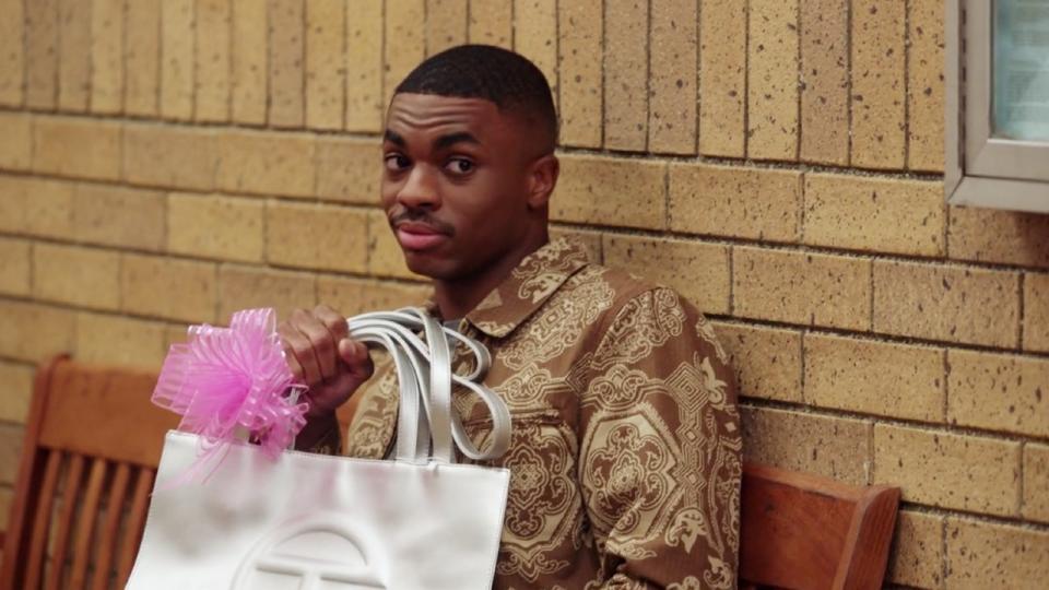 Maurice holds a Telfar bag