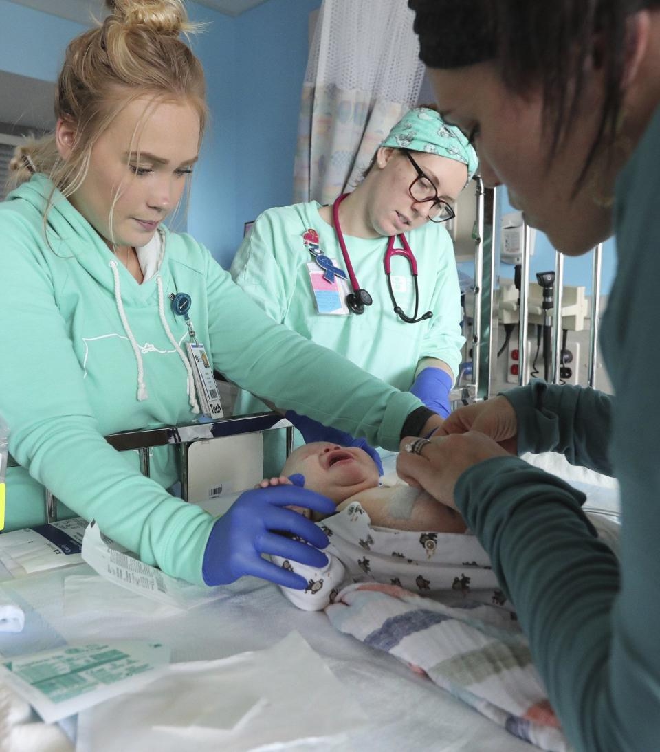 Akron Children's Hospital nurses tend to David Detwiler. (Karen Schiely)