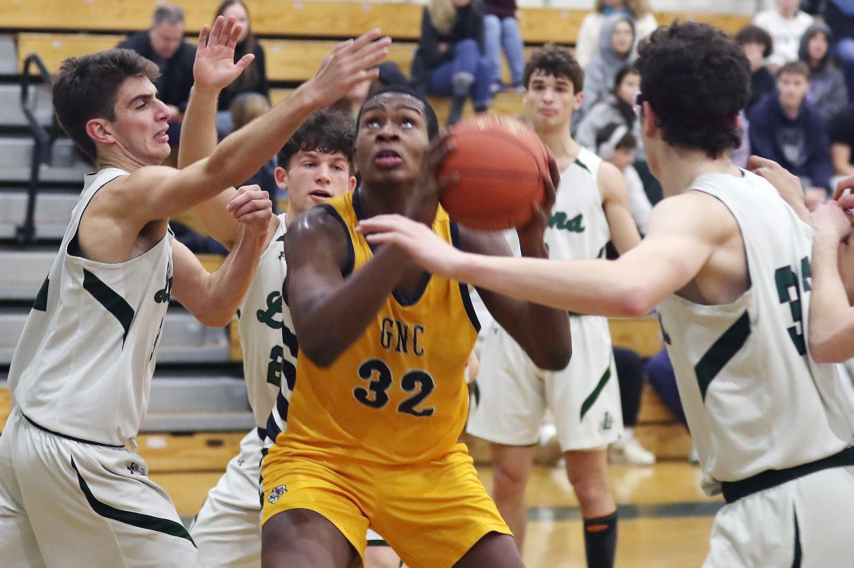 Greenburgh-North Castle's Chris Popotte (32) is surrounded by The Leffell School defenders as he tries to go up for a shot during action at The Leffell School in Greenburgh Jan. 23, 2024. Leffell won the game 80-53.