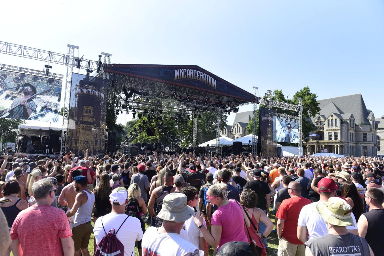 A large crowd gathers near the stage during the 2019 INKcarceration
music festival.