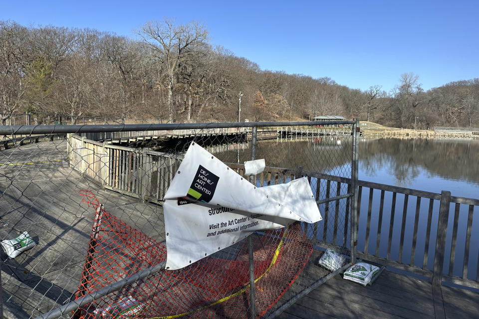 Part of an artwork, called Greenwood Pond: Double Site, is shown Sunday, Feb. 25, 2024, in Des Moines, Iowa. The Des Moines Arts Center plans to rip out the roughly 30-year-old artwork that lines a pond in a historic city park. The decision to remove the work, made up of a series of walkways, shelters and viewing sites, has outraged arts advocates nationally and surprised local residents. (AP Photo/Scott McFetridge)