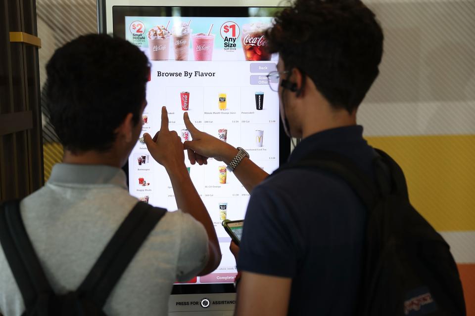 Customers use the digital screen to place an order at a McDonald’s restaurant as the companies stock price reached record territory on April 25, 2017 in Miami, Florida. (Photo by Joe Raedle/Getty Images)