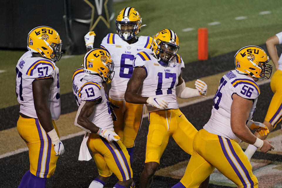 LSU wide receiver Jontre Kirklin (13) and wide receiver Racey McMath (17) celebrate after Kirklin scored a touchdown against Vanderbilt in the first half of an NCAA college football game Saturday, Oct. 3, 2020, in Nashville, Tenn. (AP Photo/Mark Humphrey)