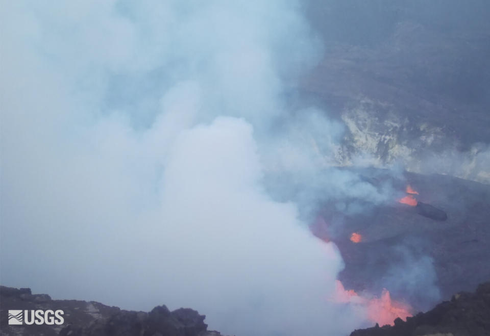 This webcam image provided by the United States Geological Survey shows a view of an eruption that has begun in the Halemaumau crater at the summit of Hawaii’s Kilauea volcano, Wednesday, Sept. 29, 2021. (USGS via AP)