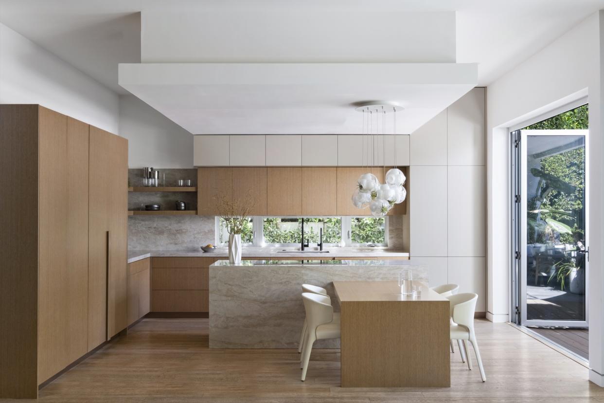  Californian kitchen with wood cabinets and marble backsplash by Victoria Holly Interiors. 