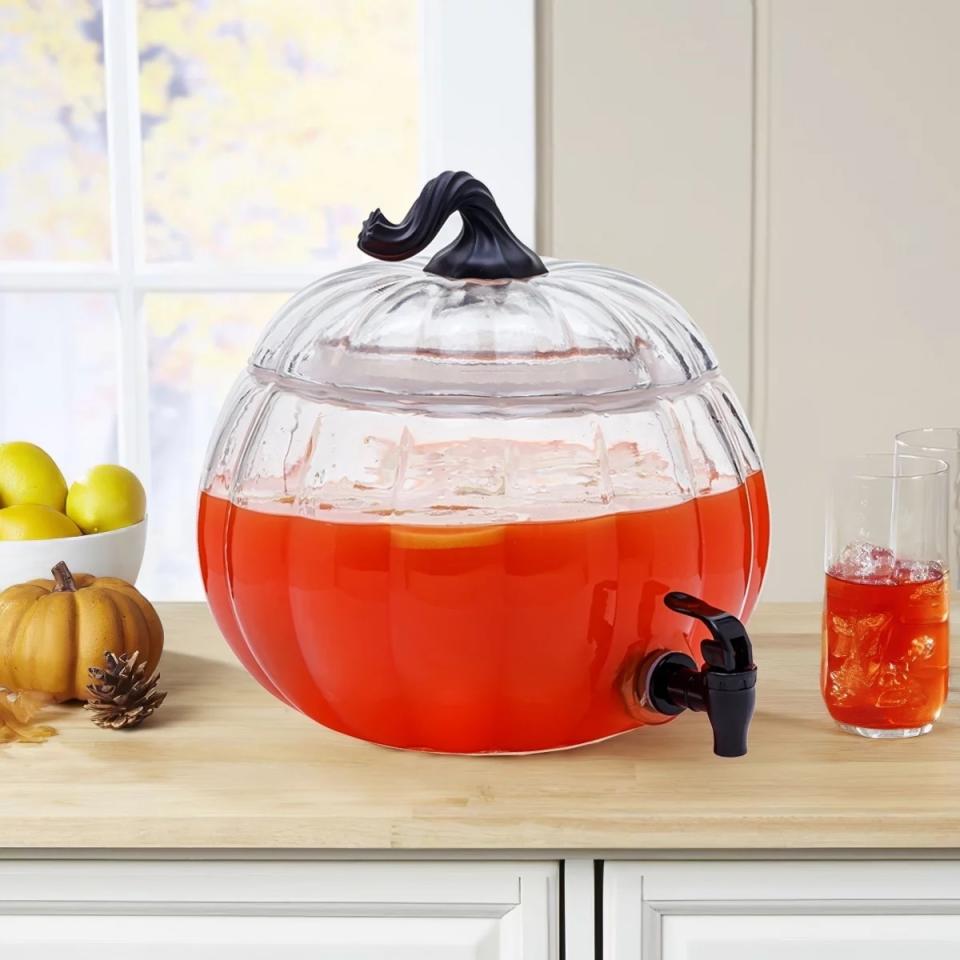 a pumpkin shaped drink dispenser