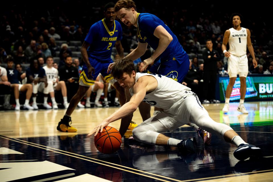 Xavier Musketeers forward Gytis Nemeiksa (50) grabs a ball in the second half of the NCAA basketball game between the Delaware Blue Hens and the Xavier Musketeers at the Cintas Center in Cincinnati on Tuesday, Dec. 5, 2023.