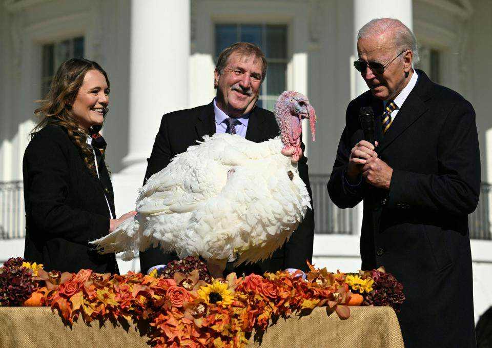 November 21, 2022: US President Joe Biden pardons Chocolate, the National Thanksgiving Turkey, as he is joined by the National Turkey Federation Chairman Ronnie Parker (C) and Alexa Starnes, Daughter of the Owner of Circle S Ranch on the South Lawn of the White House in Washington, DC.