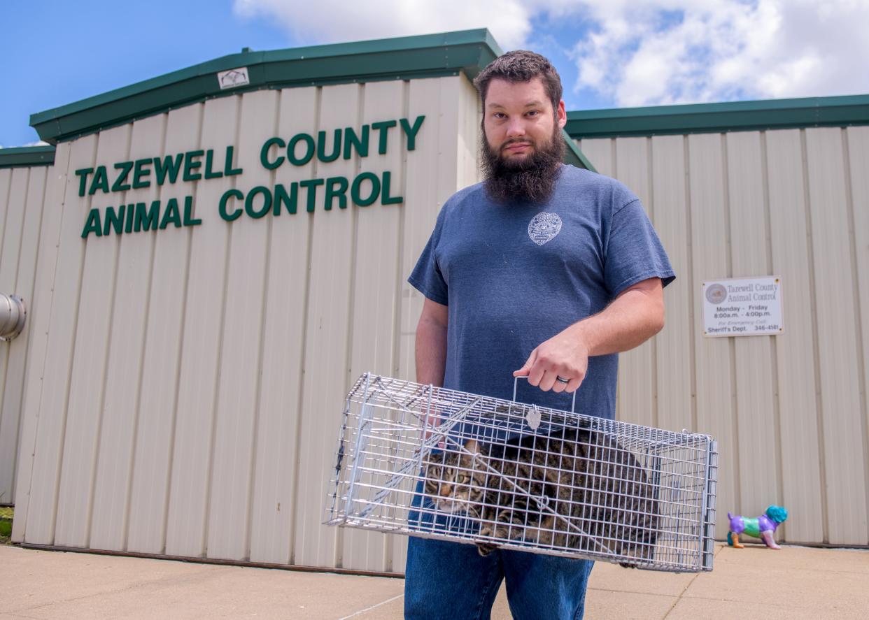 Anthony Naylor, lead animal control officer for Tazewell County Animal Control, shows one of the traps he'll be using in the TCAC's new Trap-Neuter-Return (TNR) program for feral cats.
