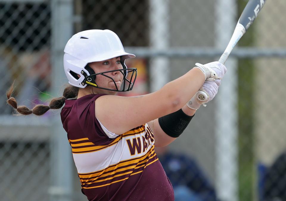 Walsh Jesuit batter McKayla McGee watches her two-run single in the seventh inning of a 4-2 win over Painesville Riverside in a Division I district semifinal softball game Monday in Massillon. [Jeff Lange/Beacon Journal]