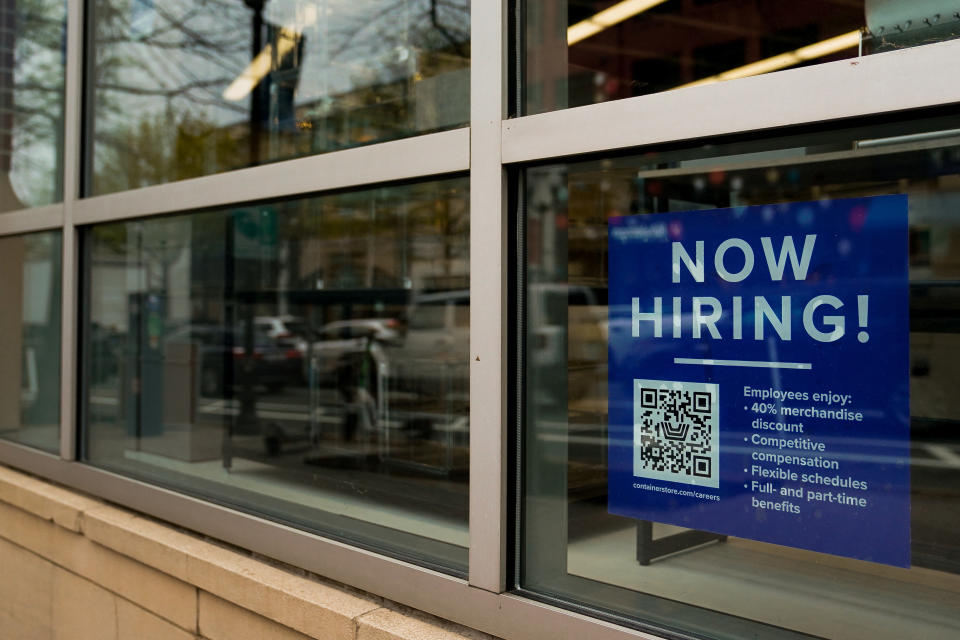 An employee hiring sign with a QR code is seen in a window of a business in Arlington, Virginia, U.S., April 7, 2023. REUTERS/Elizabeth Frantz