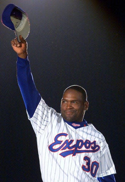 FILE - In this April 6, 2001, file photo, Montreal Expos' Tim Raines acknowledges applause from fans as he is presented before the Expos home opener in Montreal. Raines could be elected into the Baseball Hall of Fame when voting is announced Wednesday, Jan. 6, 2016. (AP Photo/Ryan Remiorz, File)