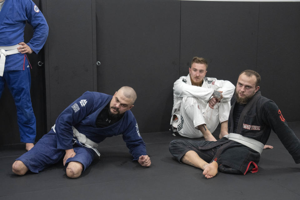 War veterans attend a jiu jitsu training session in Kyiv, Ukraine, Tuesday, Oct. 3, 2023. More than 20,000 people in the Ukraine have lost limbs from injuries since the start of the Russian war, many of them soldiers. Some of them have learned to deal with their psychological trauma by practicing a form of Brazilian jiu-jitsu. (AP Photo/Efrem Lukatsky)