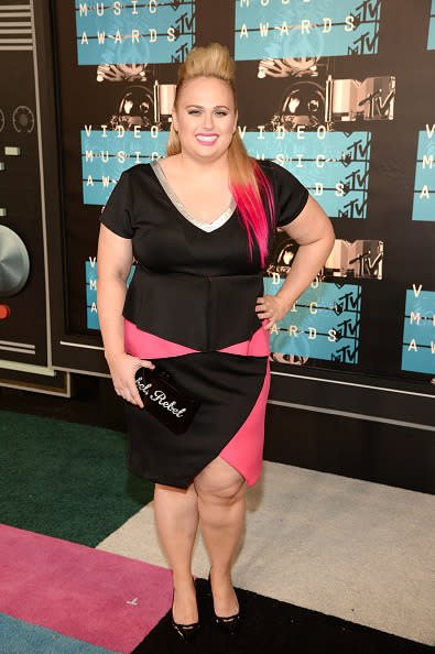 <p>The “Pitch Perfect” actress matched her hot pink dip-dyed ponytail with her black and pink asymmetrical dress.</p>