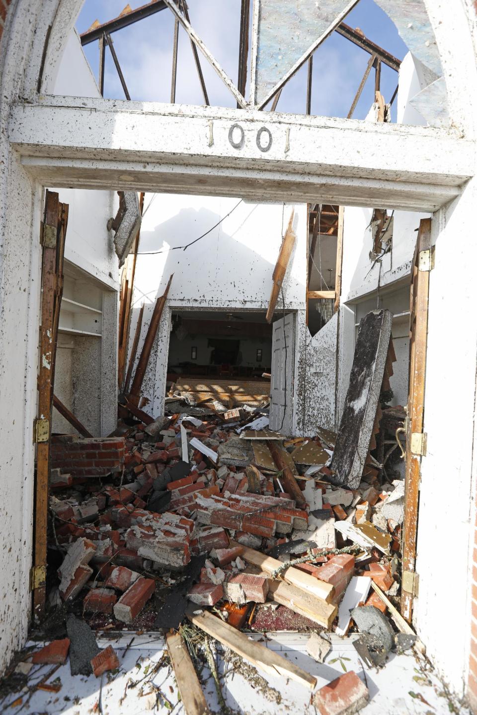 Little remains undamaged of the interior of Cottrell Memorial CME Church after a morning tornado hit early Saturday, Jan. 21, 2017 in south Hattiesburg, Miss. The tornado was part of a wall of stormy weather traveling across the region, bringing with it rain and unstable conditions. (AP Photo/Rogelio V. Solis)