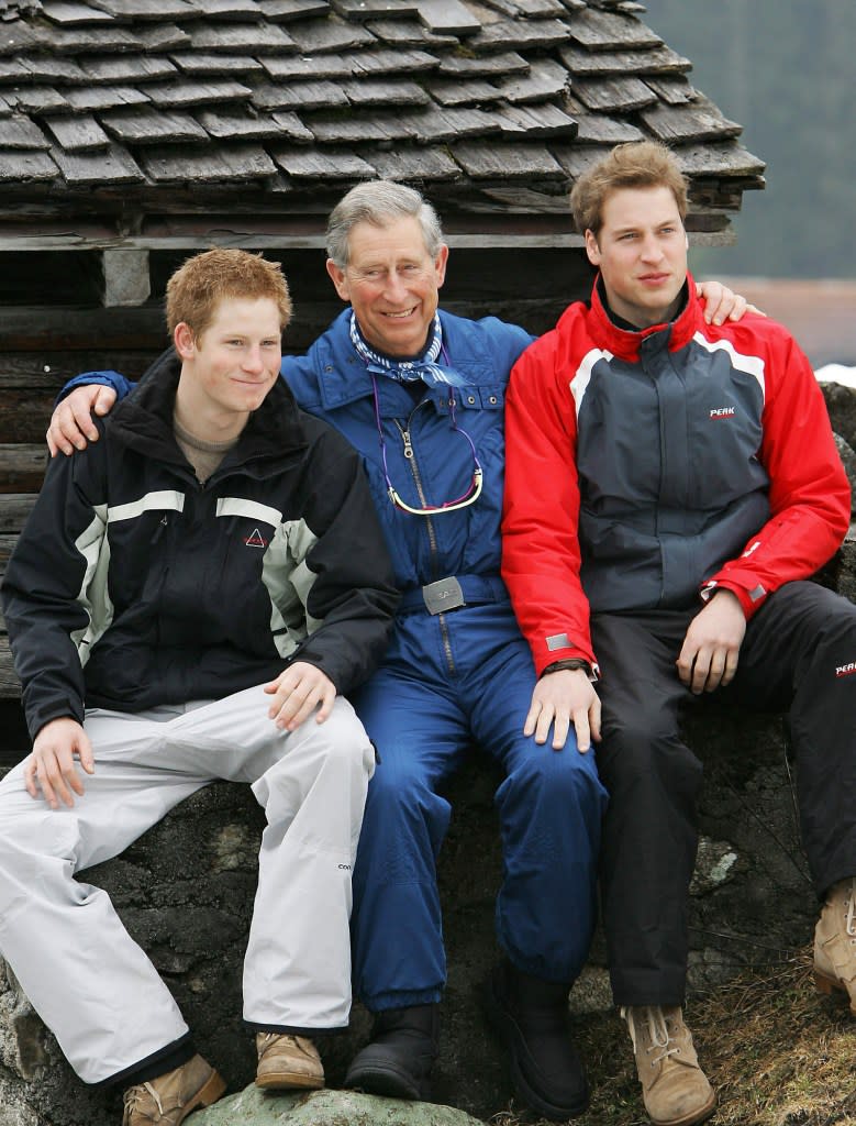 Prince Harry, King Charles and Prince William during their holidays in Switzerland on March 31, 2005. AFP via Getty Images