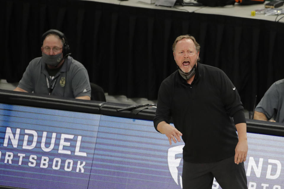 Milwaukee Bucks head coach Mike Budenholzer shouts from the sideline during the first half of an NBA basketball game against the Brooklyn Nets Tuesday, May 4, 2021, in Milwaukee. (AP Photo/Aaron Gash)