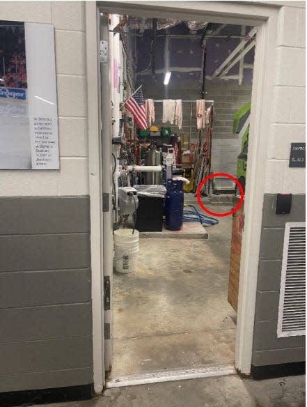 This is the door through which an ice crew employee said he saw Red Wings Zamboni driver Al Sobotka pee into an ice drain in 2022. The drain is circled in the image.