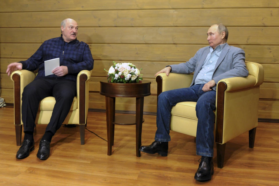 Russian President Vladimir Putin, right, listens to Belarusian President Alexander Lukashenko during their meeting in the Black Sea resort of Sochi, Russia, Monday, Feb. 22, 2021. (Alexei Druzhinin, Sputnik, Kremlin Pool Photo via AP)