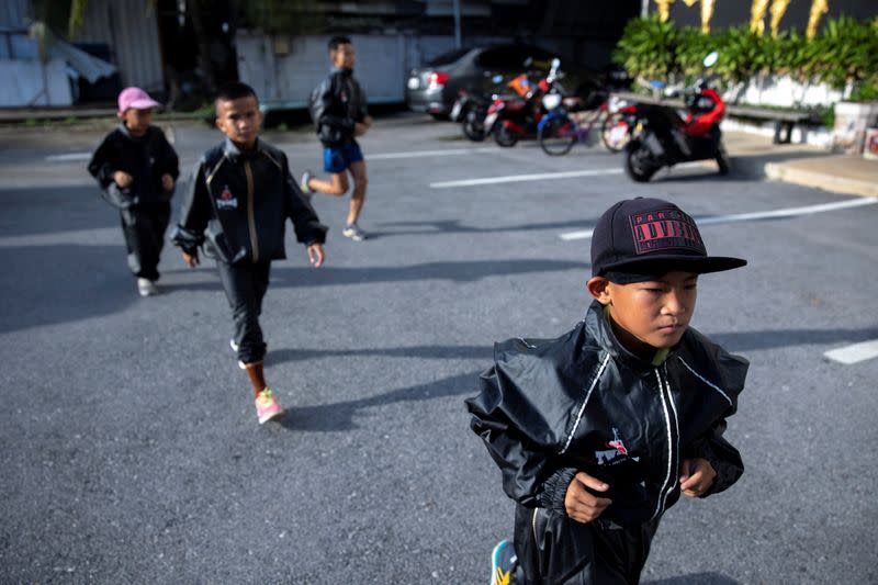 The Wider Image: Punching out of poverty: Despite risks, nine-year-old Thai fighter eager to return to ring