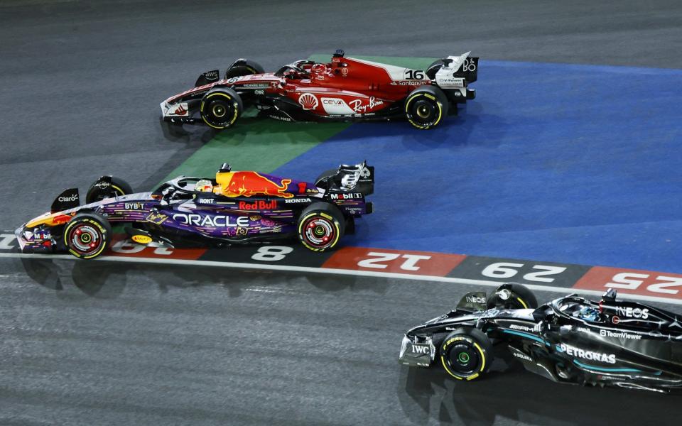 Max Verstappen of the Netherlands driving the (1) Oracle Red Bull Racing RB19 overtakes Charles Leclerc of Monaco driving the (16) Ferrari SF-23 at turn one during the F1 Grand Prix of Las Vegas at Las Vegas Strip Circuit on November 18, 2023 in Las Vegas, Nevada
