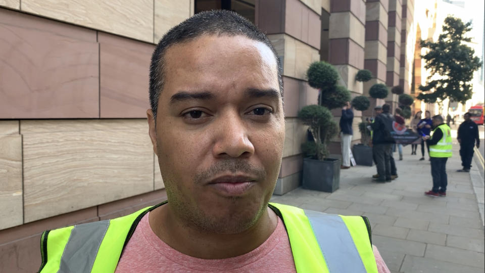 Cleaner Julian Ortiz demonstrated outside a WeWork office in London, saying he was protesting his dismissal by its cleaning firm CCM. Photo: Yahoo Finance UK / Tom Belger