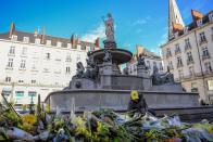 <p>Supporters pay their respects in the main square of Nantes (Getty Images) </p>