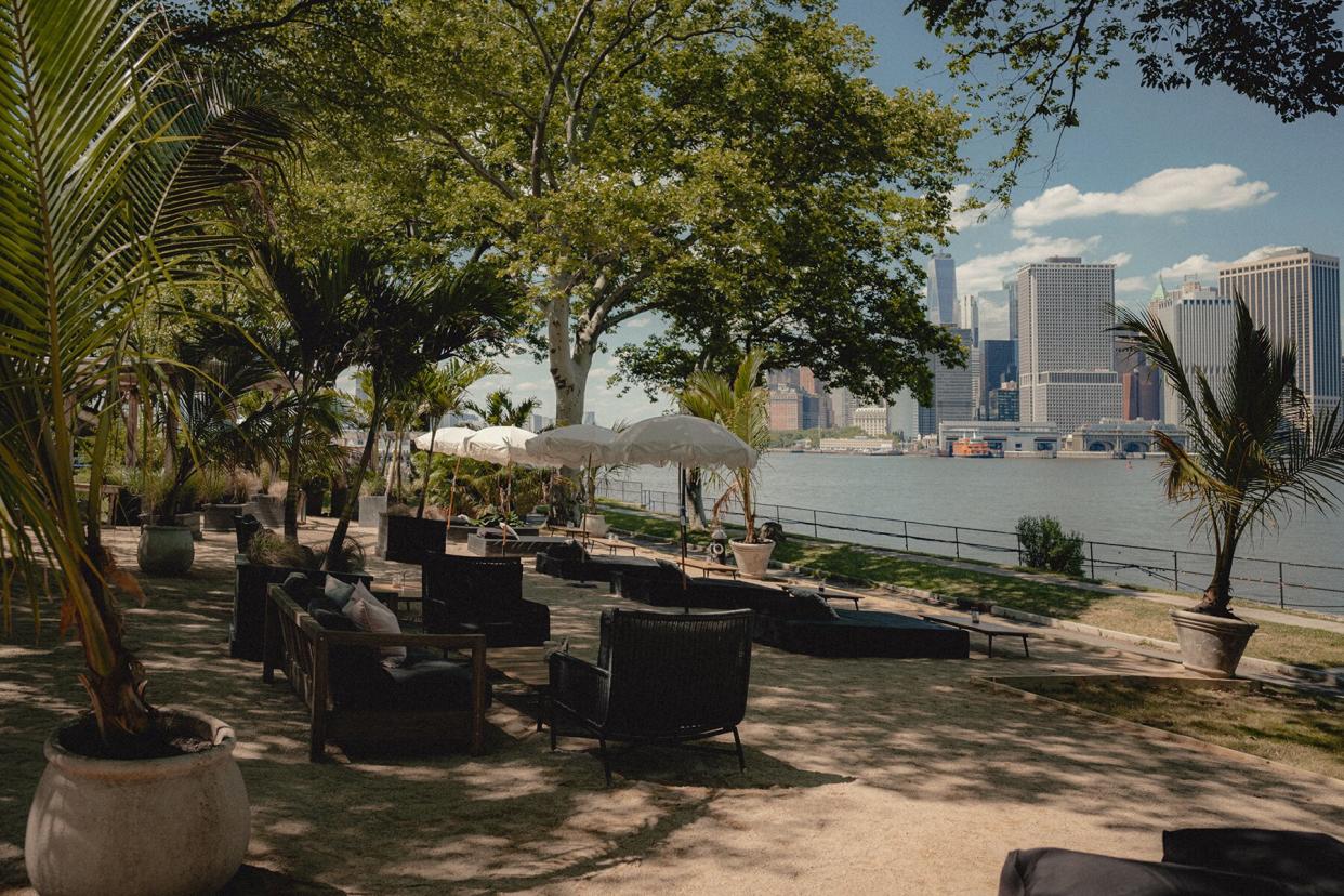 Loungers looking at the nyc skyline at GITANO Island