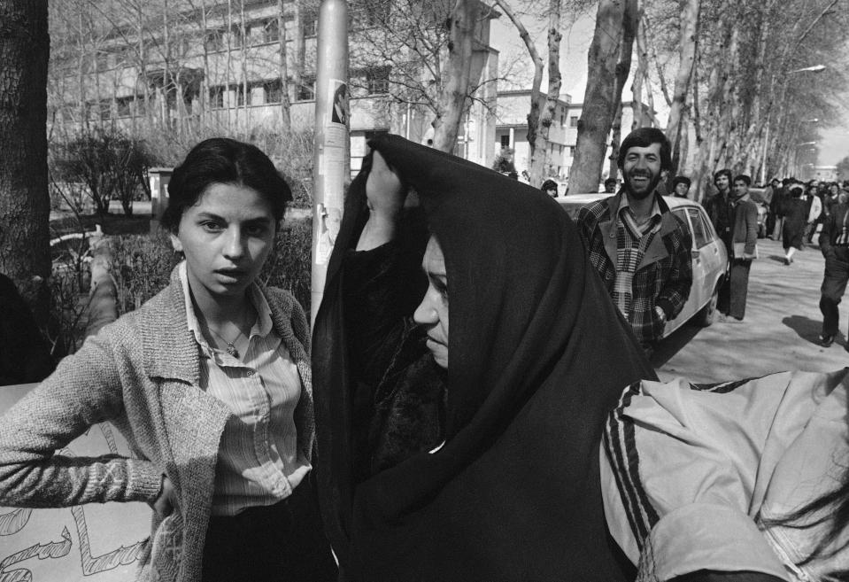 File - Iranian women in religious and western style dress demonstrate for equal rights in Tehran, March 12, 1979. Iran's Islamic Republic requires women to cover up in public. But many Iranian women have long played a game of cat-and-mouse with authorities as a younger generation wears their veils more loosely or skirts requirements for conservative dress. (AP Photo/Richard Tomkins, File)
