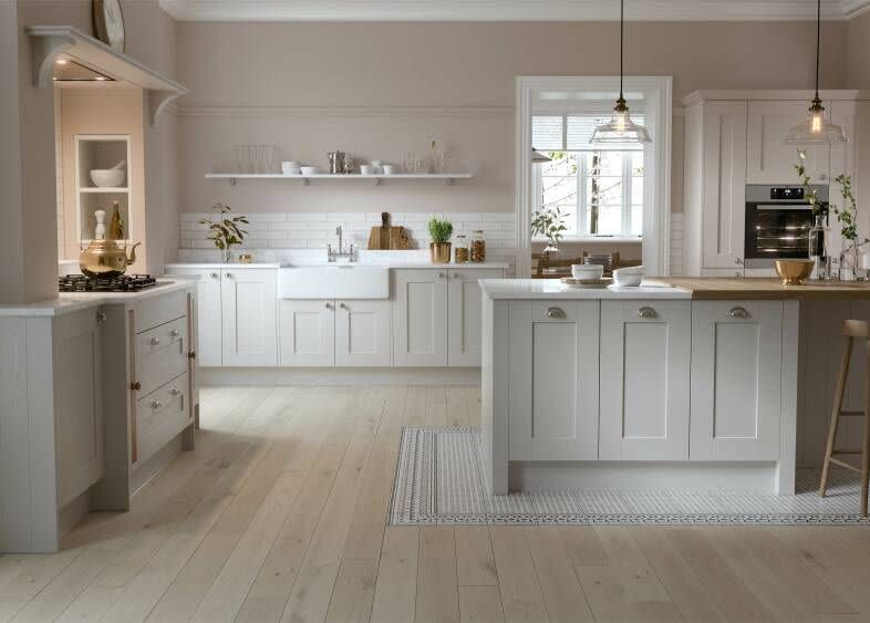 <p>Where bold colours can make your white cabinets stand out, soft contrasts can have a calming effect in a white kitchen. This mix of pale wood floors, off-white shaker cabinets, and delicate blush walls is modern without being overly saccharine.</p><p>Pictured: <a href="https://www.wrenkitchens.com/kitchens/shaker-forest-shadow-grain/10514" rel="nofollow noopener" target="_blank" data-ylk="slk:Shaker Forest Kitchen in Shadow at Wren;elm:context_link;itc:0;sec:content-canvas" class="link ">Shaker Forest Kitchen in Shadow at Wren</a><strong><br><br>Follow House Beautiful on <a href="https://www.instagram.com/housebeautifuluk/" rel="nofollow noopener" target="_blank" data-ylk="slk:Instagram;elm:context_link;itc:0;sec:content-canvas" class="link ">Instagram</a>.</strong></p>