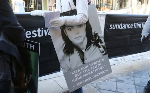 A sign outside of the premiere of the "Leaving Neverland" Michael Jackson documentary film  - Credit: AP