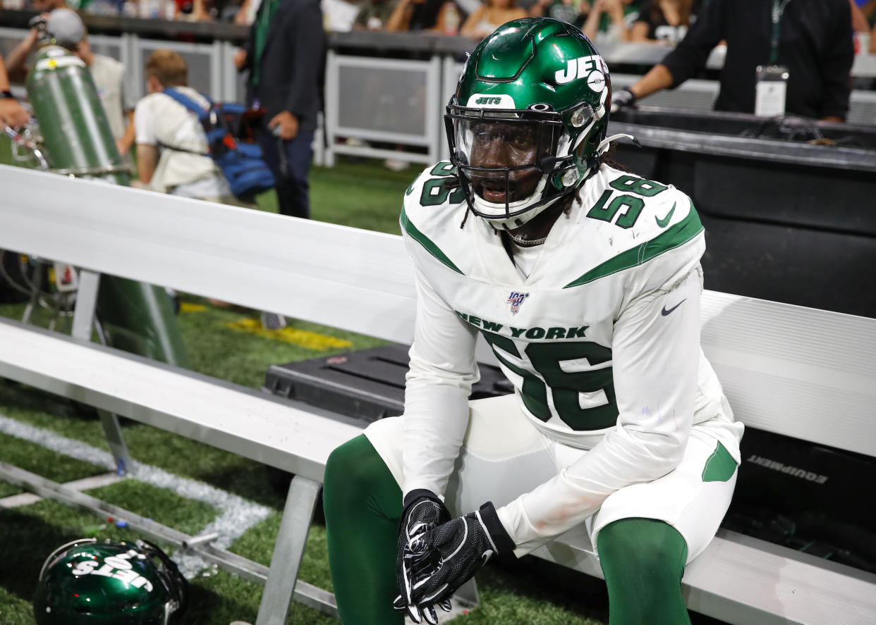 ATLANTA, GA - AUGUST 15: Jachai Polite #56 of the New York Jets rests on the bench during the second half of an NFL preseason game against the Atlanta Falcons at Mercedes-Benz Stadium on August 15, 2019 in Atlanta, Georgia. (Photo by Todd Kirkland/Getty Images)