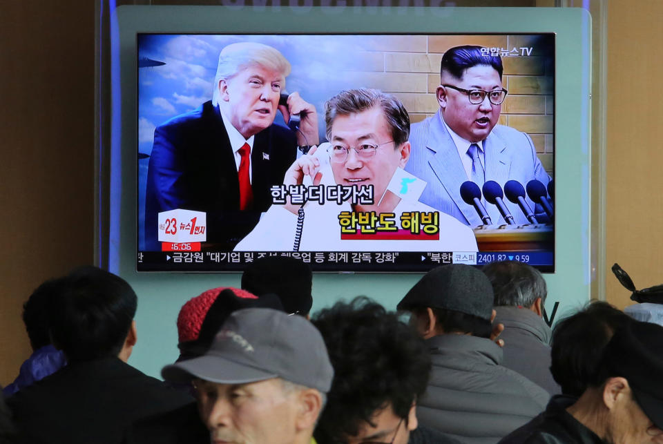 FILE - In this March 7, 2018, file photo, people watch a TV screen showing images of North Korean leader Kim Jong Un, right, South Korean President Moon Jae-in, center, and U.S. President Donald Trump at the Seoul Railway Station in Seoul, South Korea. With the next meeting between U.S. President Donald Trump and North Korean leader Kim Jong Un set for Feb. 27-28 in Vietnam, there’s hope and caution in South Korea on whether the leaders could agree to tangible steps toward reducing the North’s nuclear threat after a year of soaring but fruitless talks. (AP Photo/Ahn Young-joon, File)