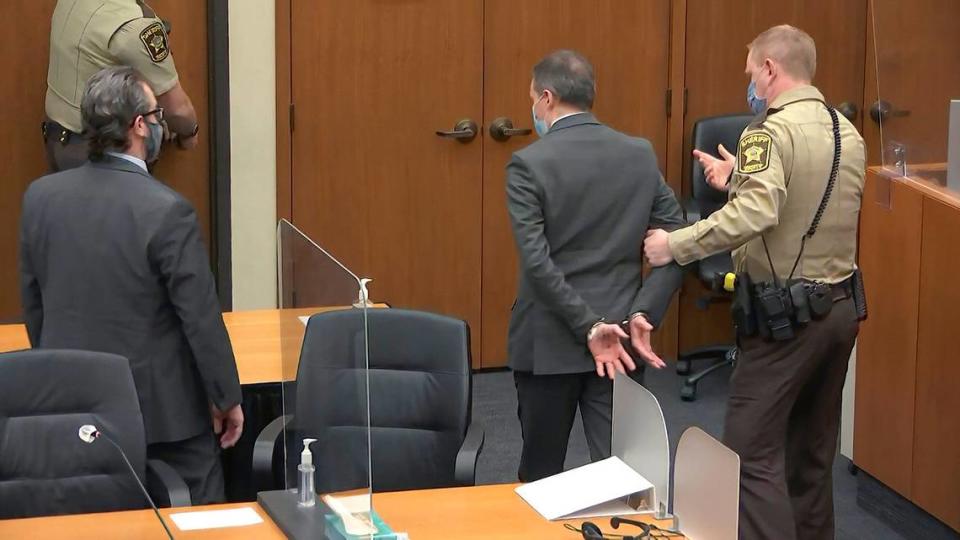 In this image from video, former Minneapolis police officer Derek Chauvin is taken into custody as his attorney Eric Nelson, left, watches, after his bail was revoked after he was found guilty on all three counts in his trial for the 2020 death of George Floyd, Tuesday, April 20, 2021, at the Hennepin County Courthouse in Minneapolis. (Court TV via AP, Pool)