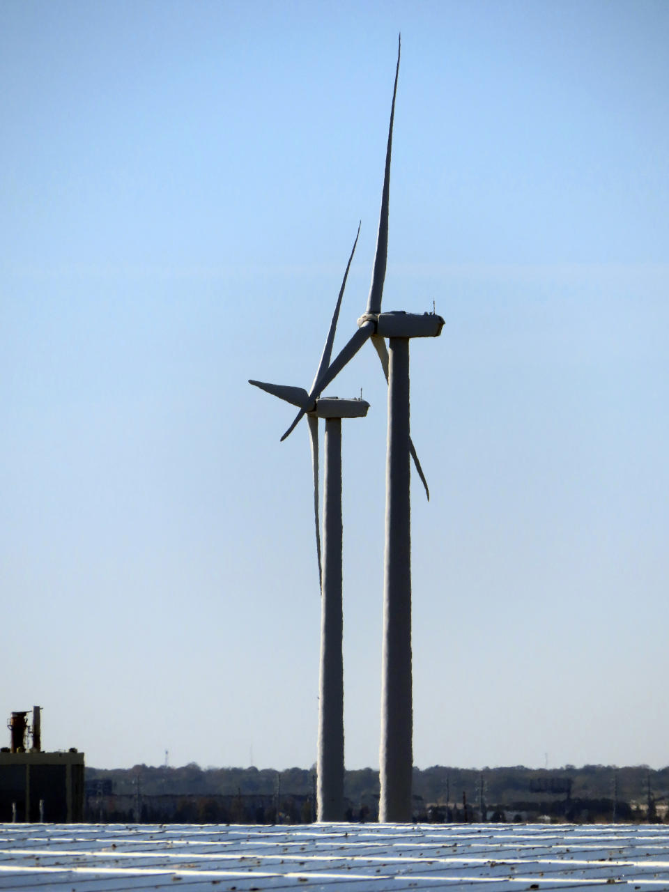 Land-based wind turbines spin in Atlantic City. N.J., on Nov. 3, 2023. On Tuesday, April 30, 2024, New Jersey utility regulators opened a fourth round of solicitations for new offshore wind farm proposals to join the three that already have preliminary approval. (AP Photo/Wayne Parry)